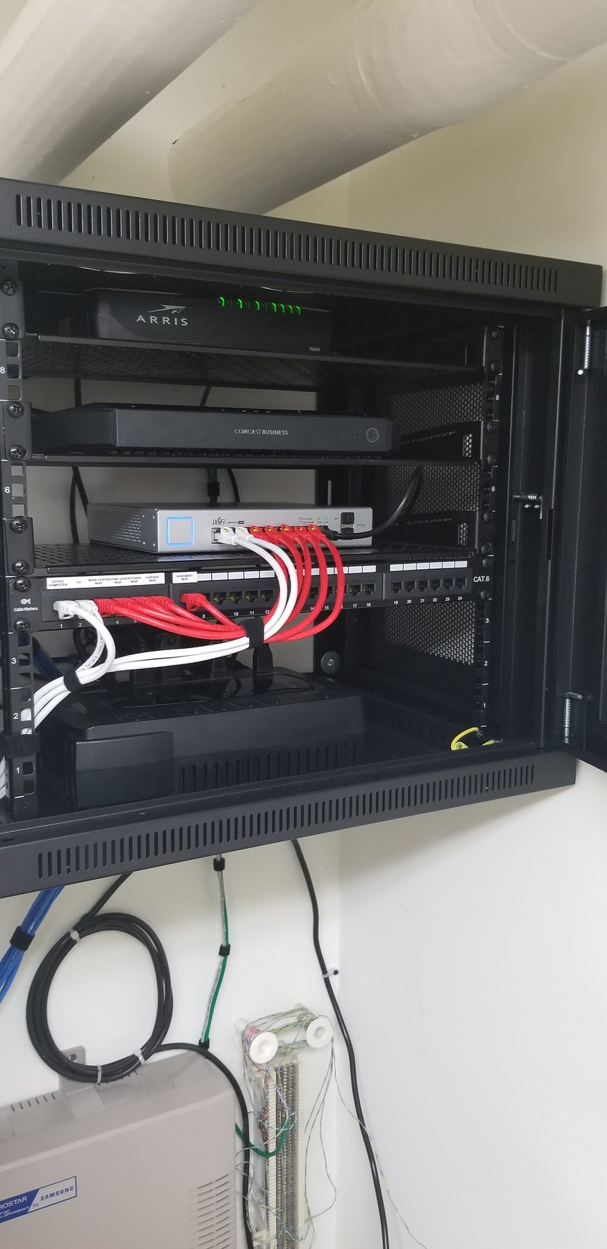 Open residential network cabinet with labeled patching for whole-home wireless access points