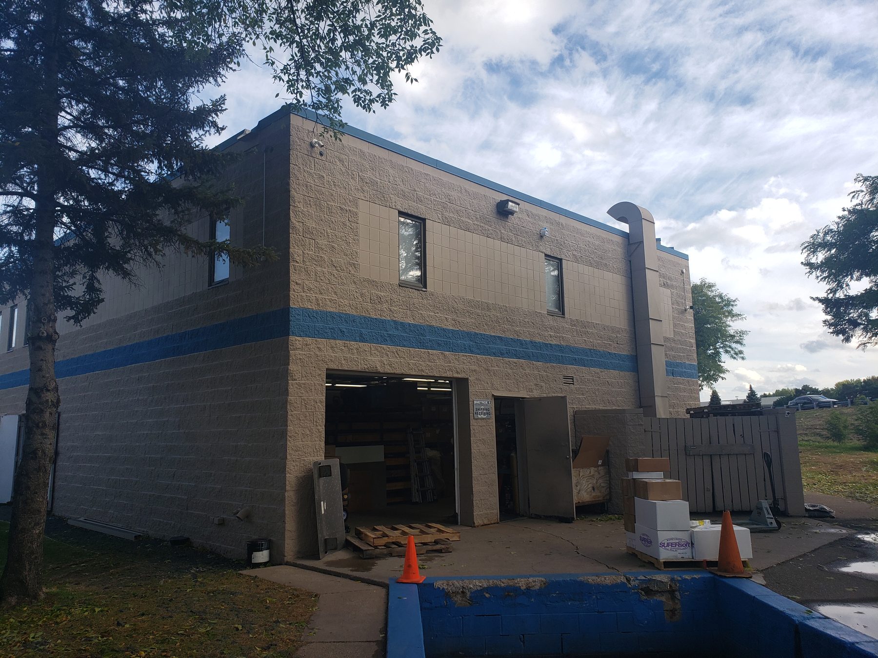 Loading and service area of the building with cameras covering the open overhead door